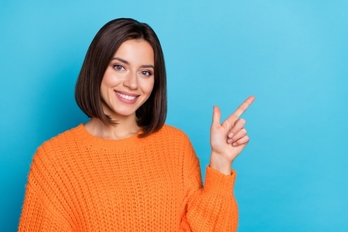 Portrait,Of,Attractive,Cheerful,Girl,Demonstrating,Copy,Empty,Space,Ad